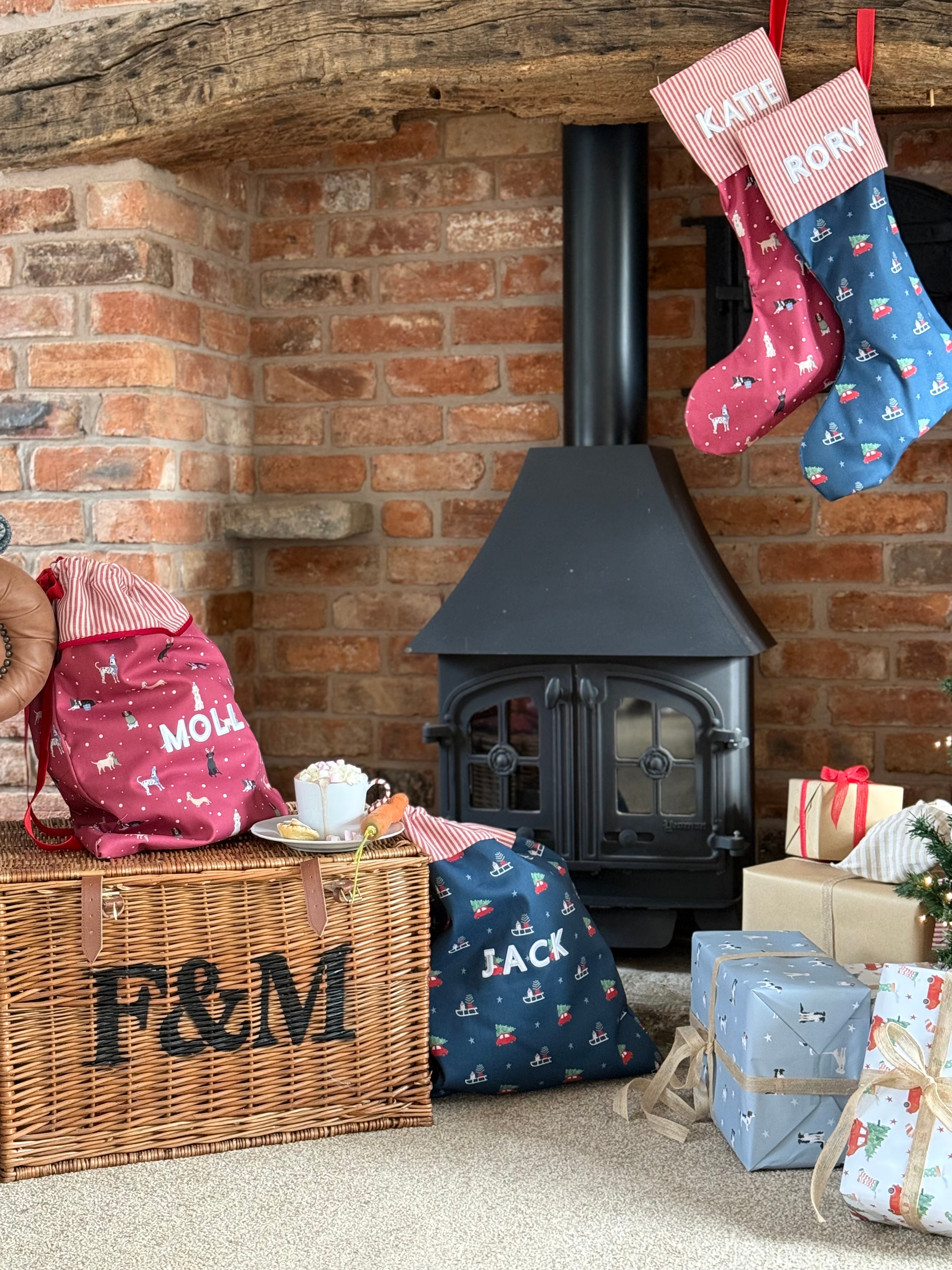 Cosy living room with a fireplace, stockings, and sacks.