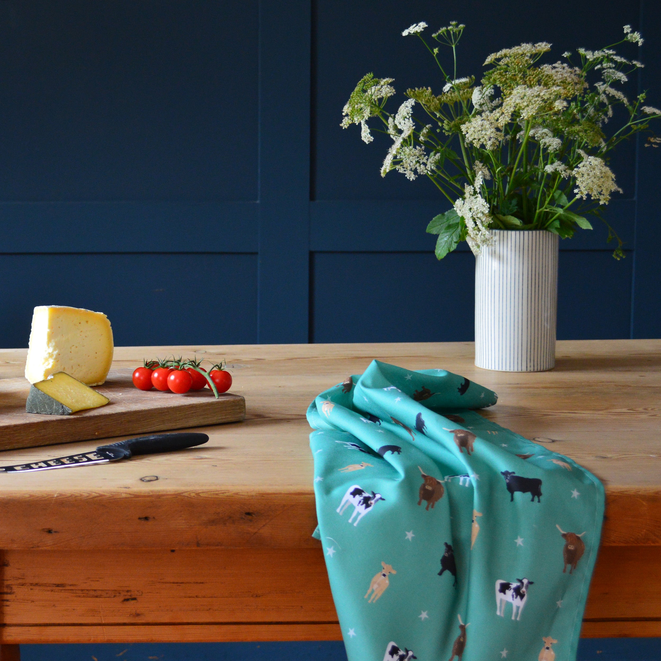 Country kitchen green tea towel featuring cows