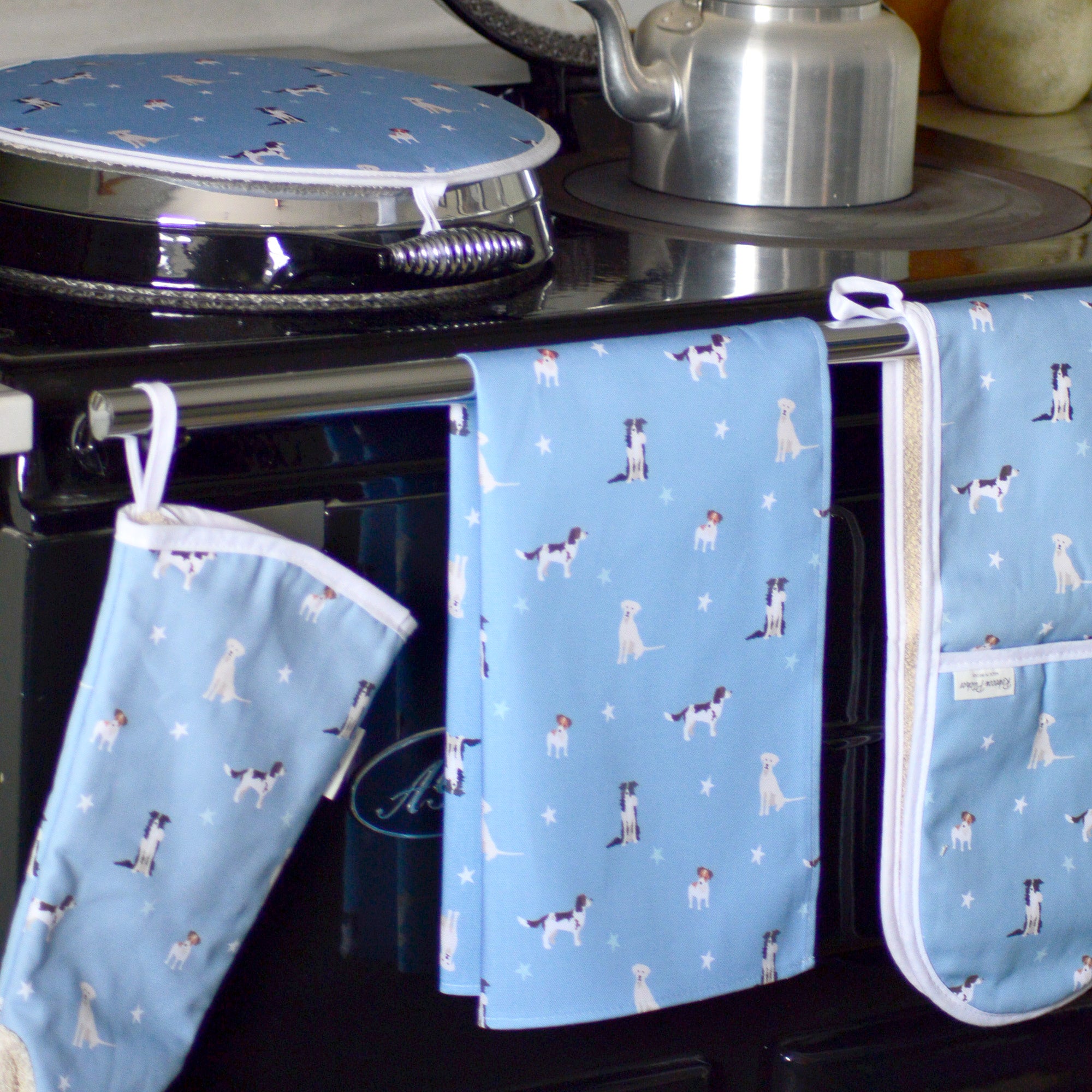 Blue Dogs design kitchen textiles on a cooker rail