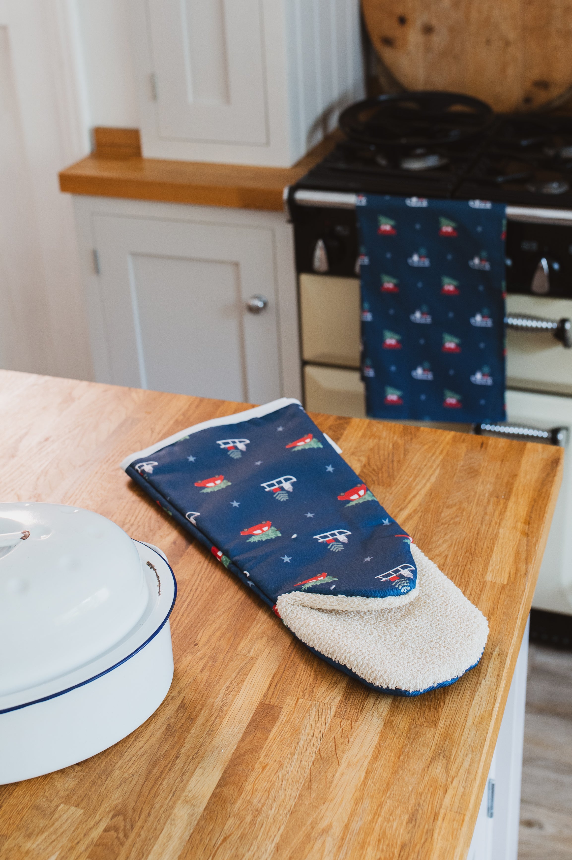 Navy Long Single Oven Glove with Christmas design in a country kitchen