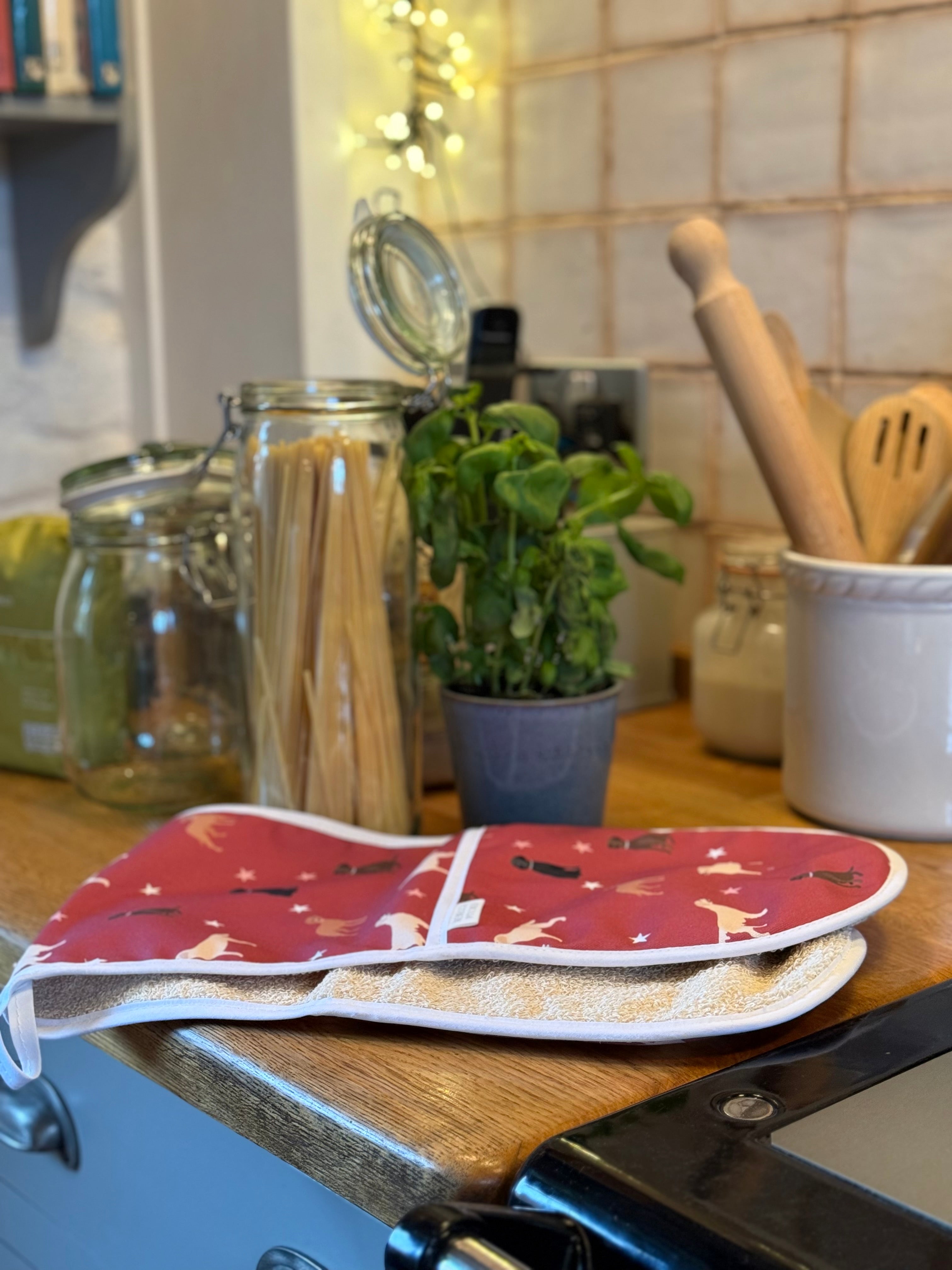 Red labrador print double oven gloves on a country kitchen worktop