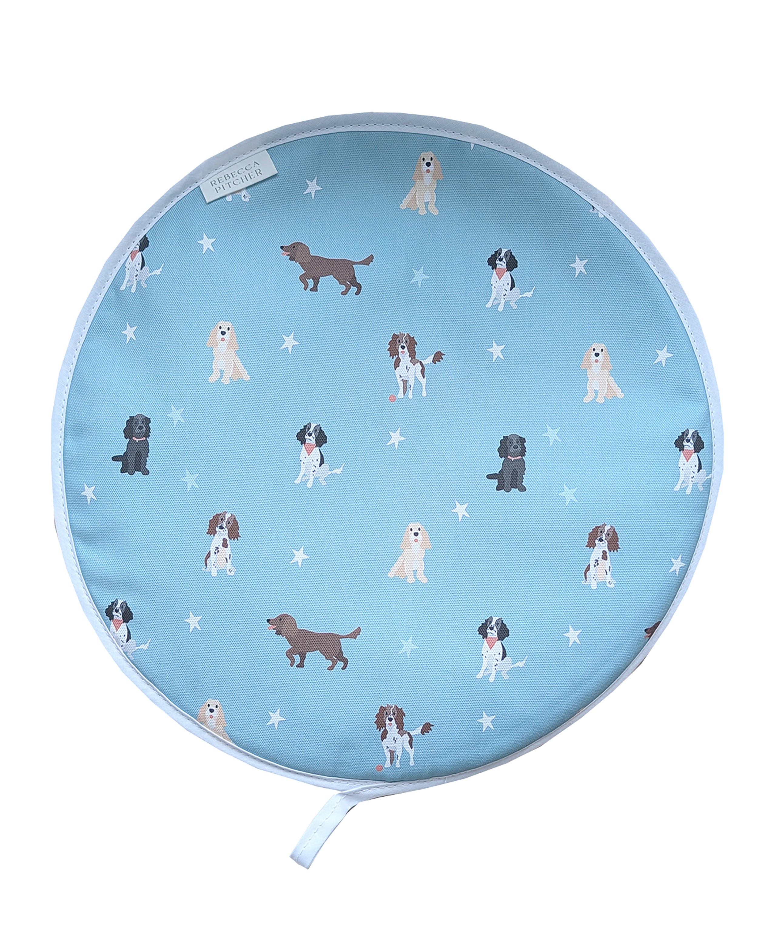 Round hob cover with spaniel dog pattern on a duckegg blue background