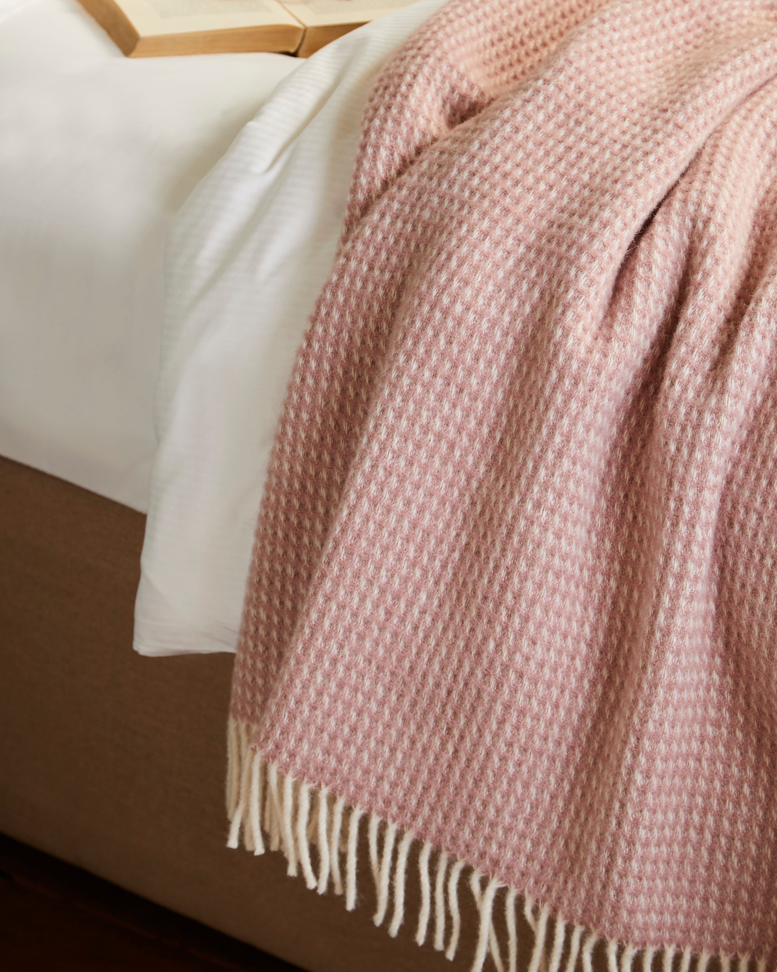 Pink Waffle weave blanket on a bed