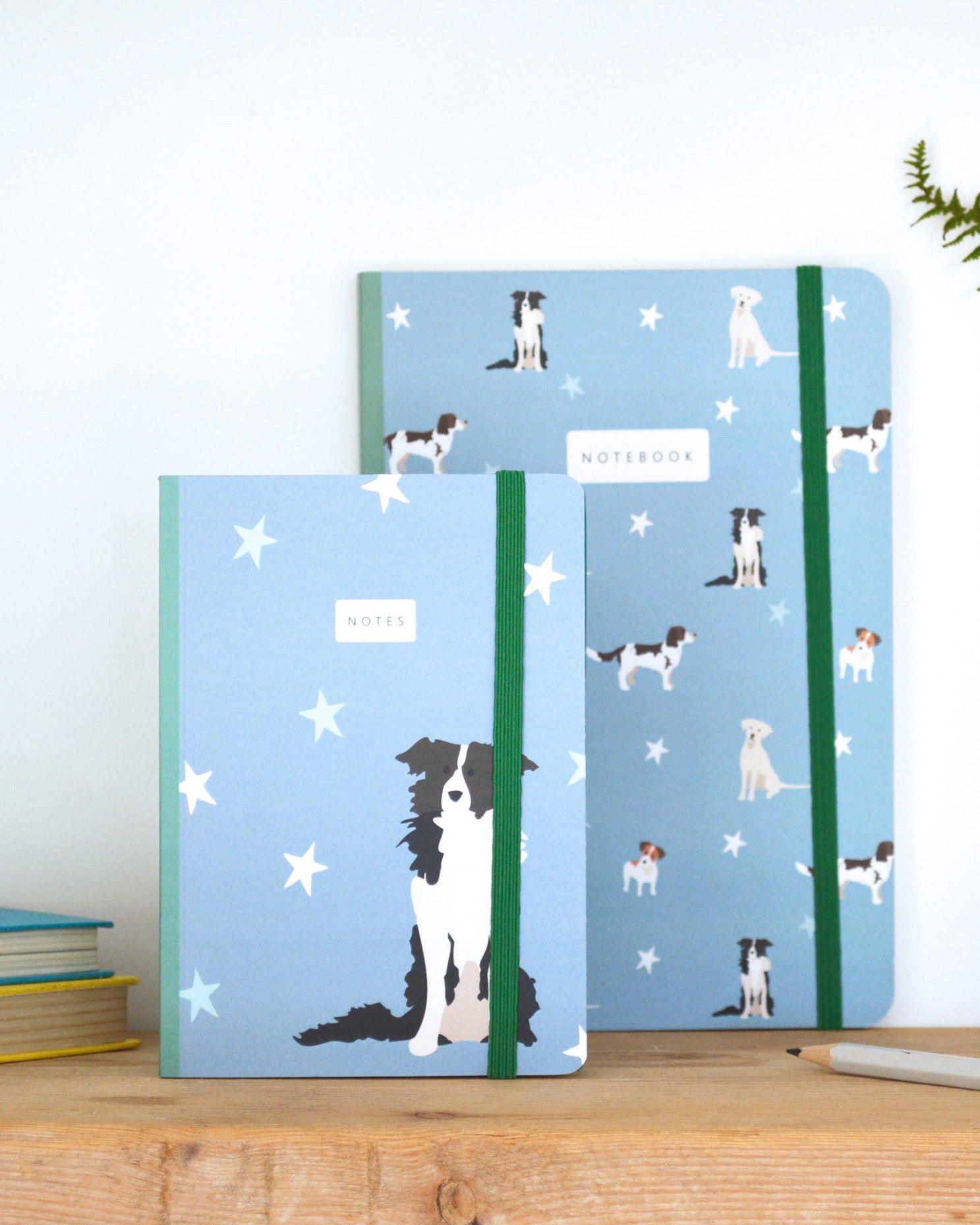 A6 and A5 Dog patterned notebooks on a shelf