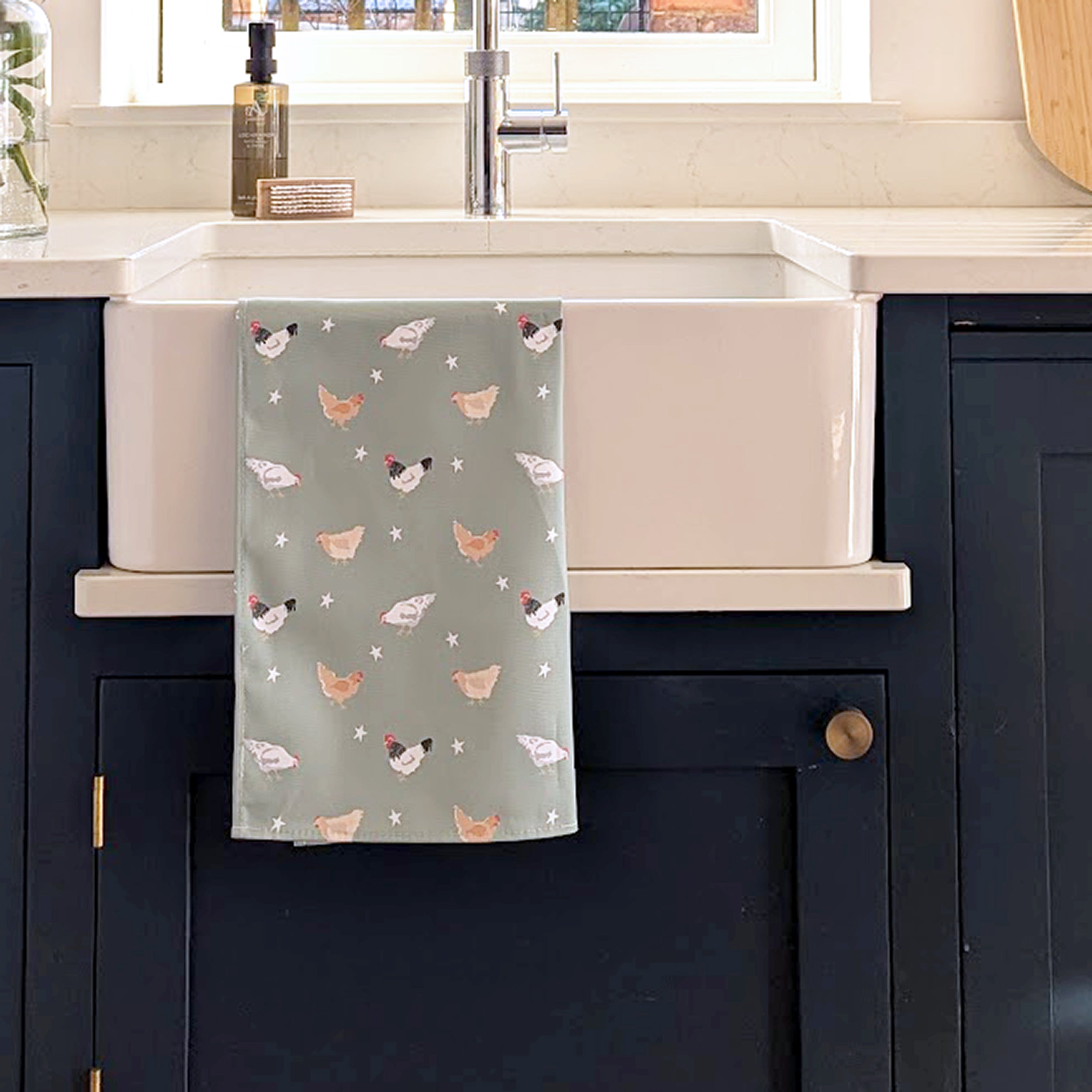 Green Chicken Design Tea Towel on a kitchen sink