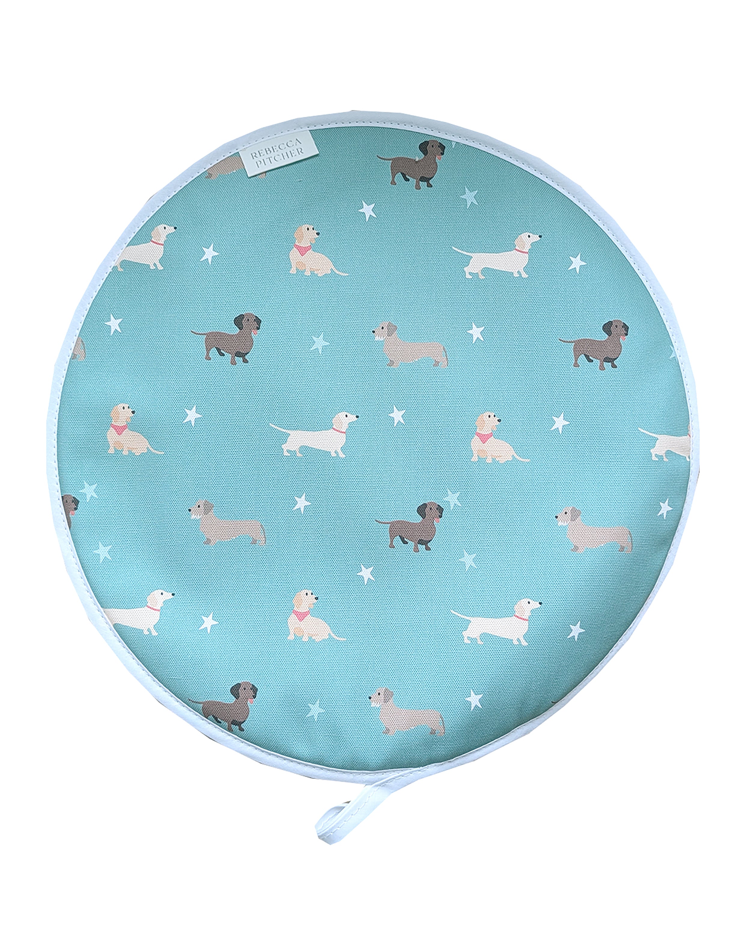 Round hob cover with dachshund dog pattern on a green background