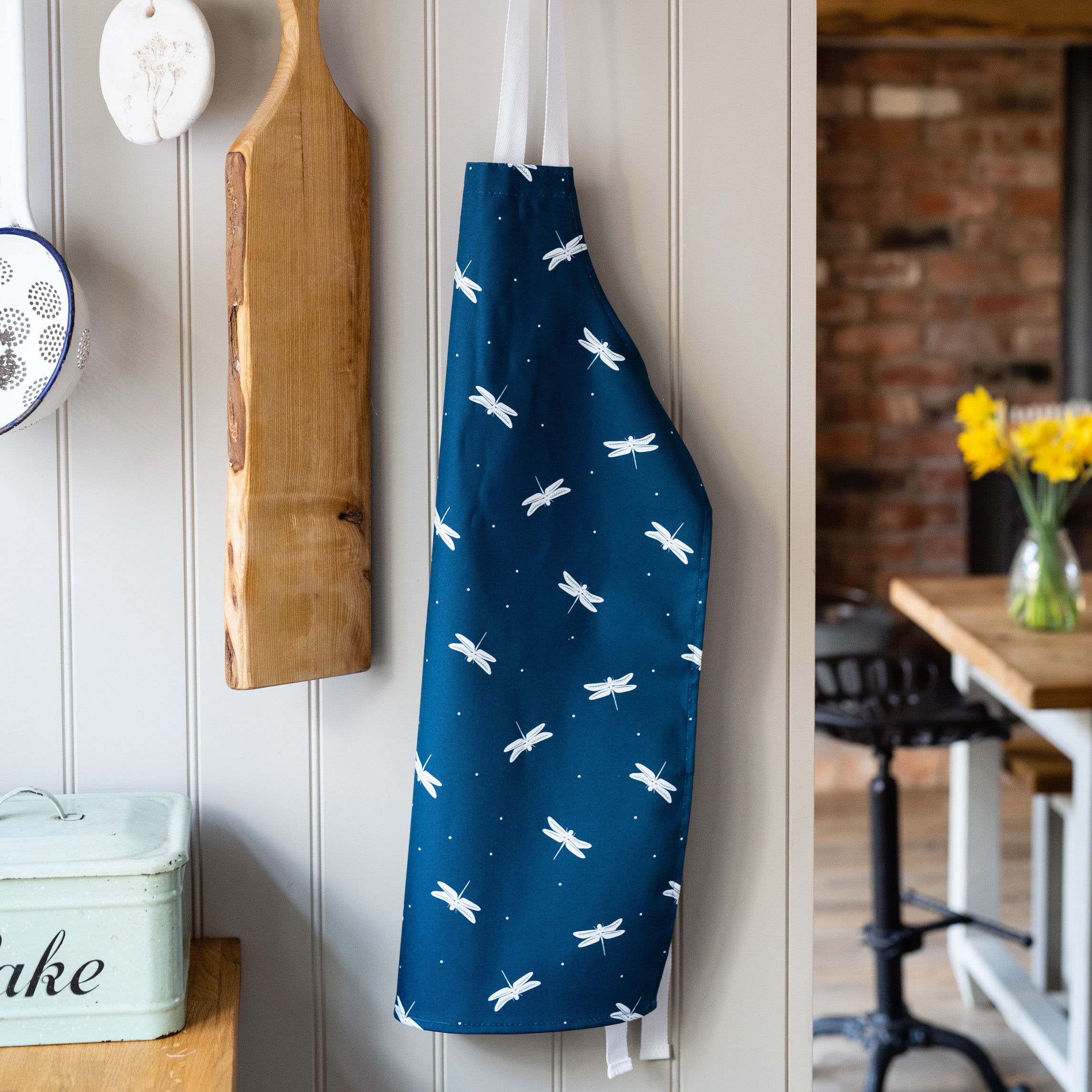 Navy Blue Dragonfly Childrens apron in a country kitchen
