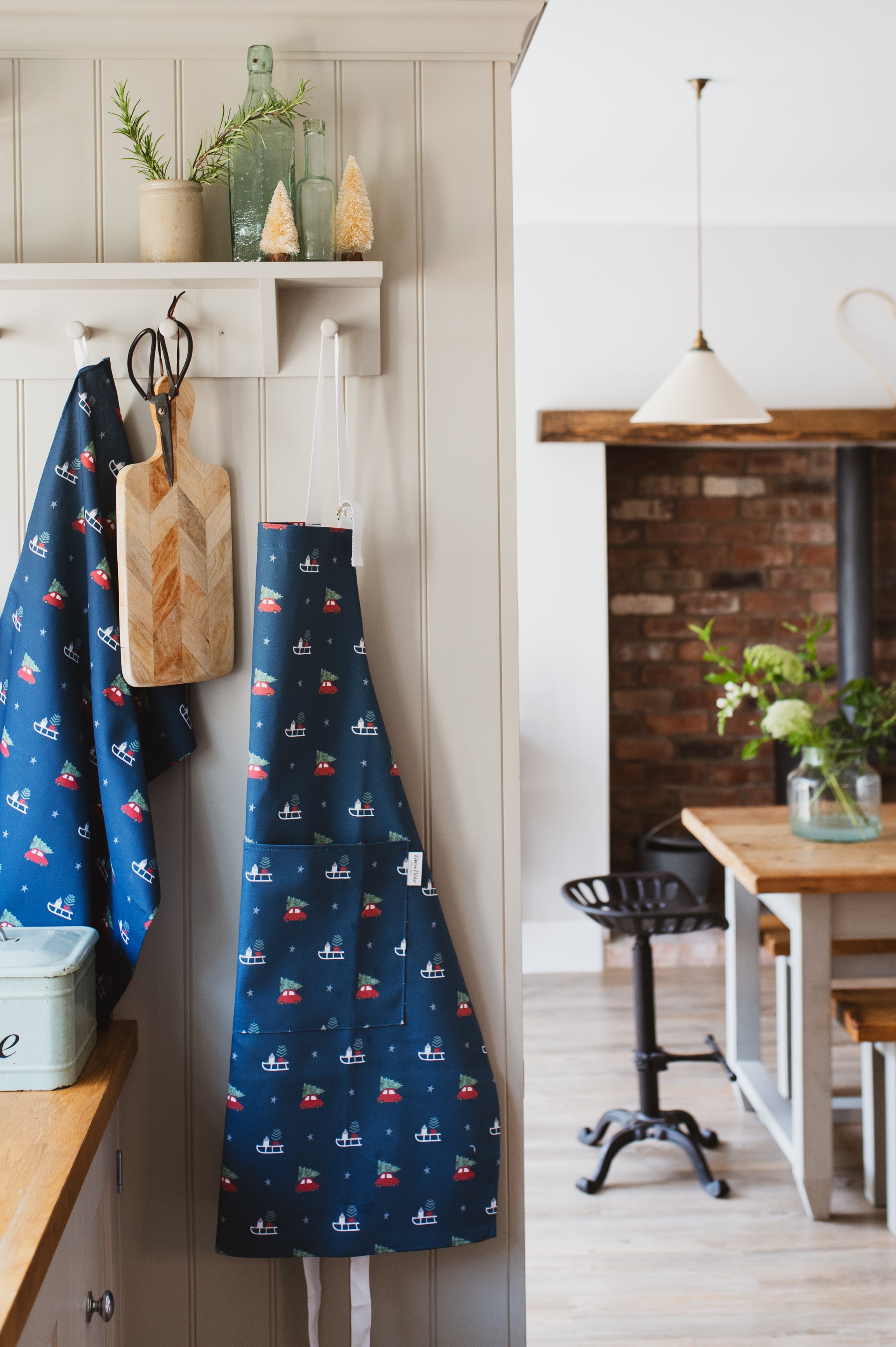 Navy Christmas Apron and Tea Towel in a Country Kitchen