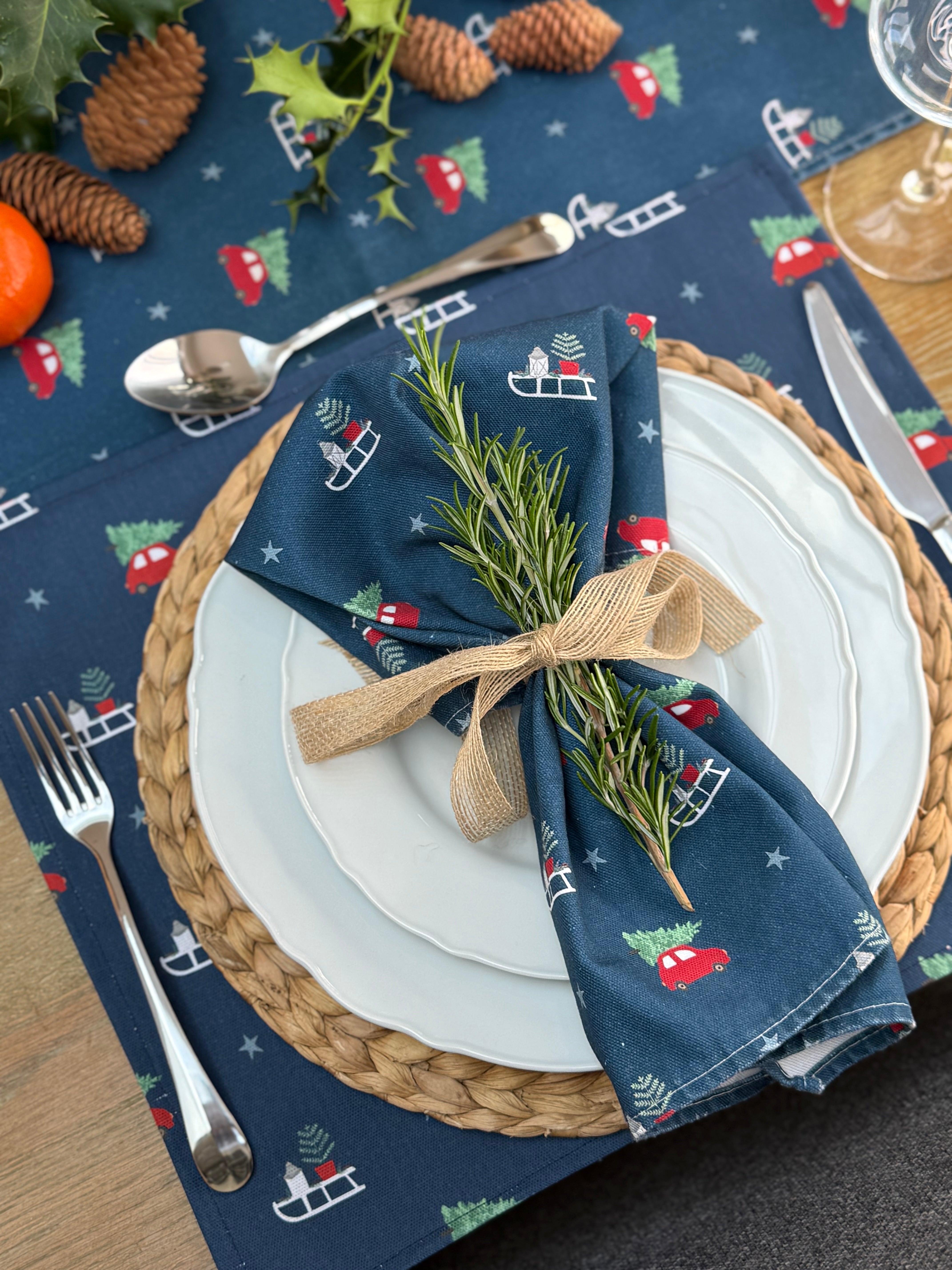Navy Christmas Placemats and napkins on a rustic Christmas table