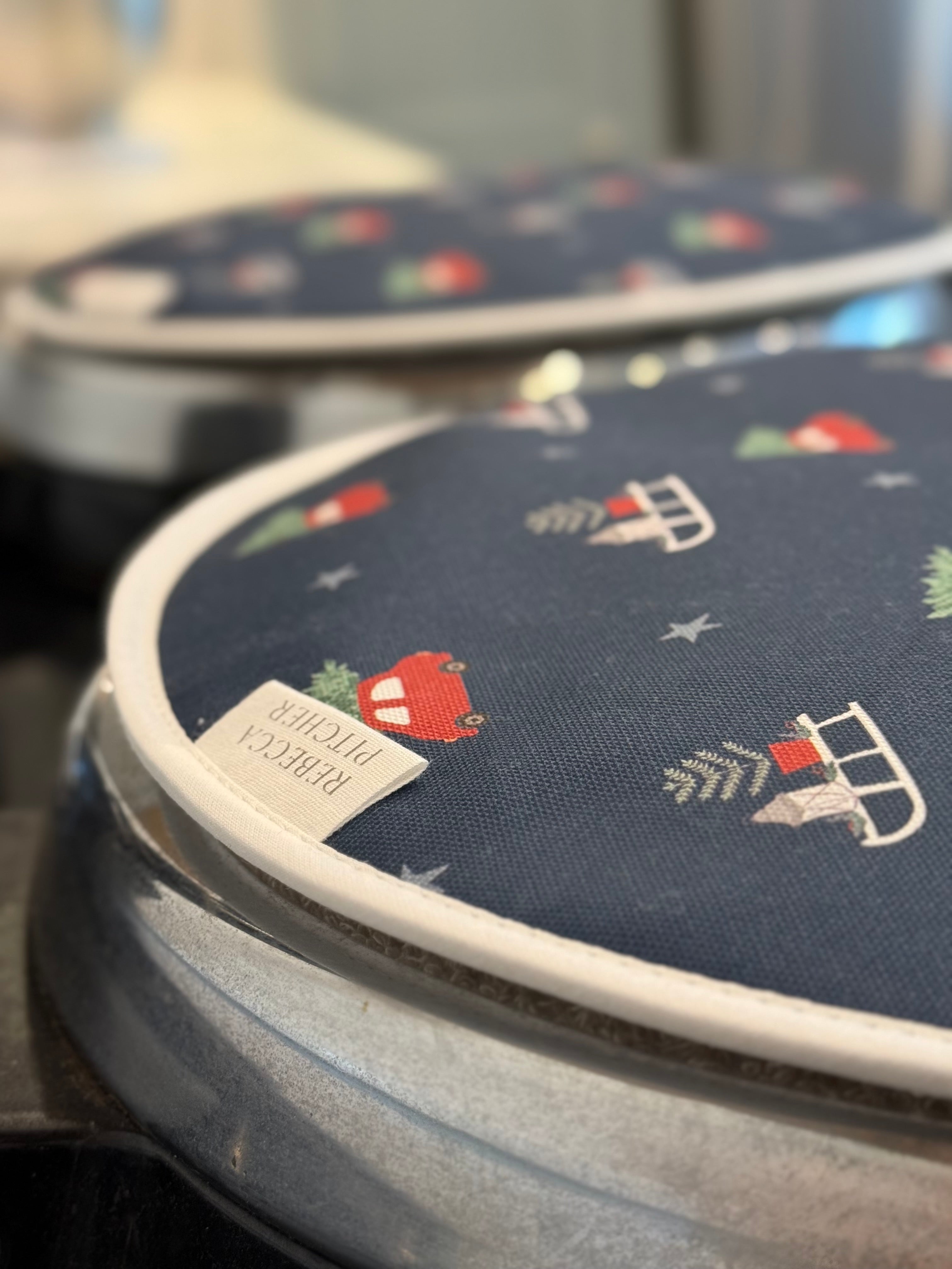 Close up of navy Driving Home for Christmas design hob covers