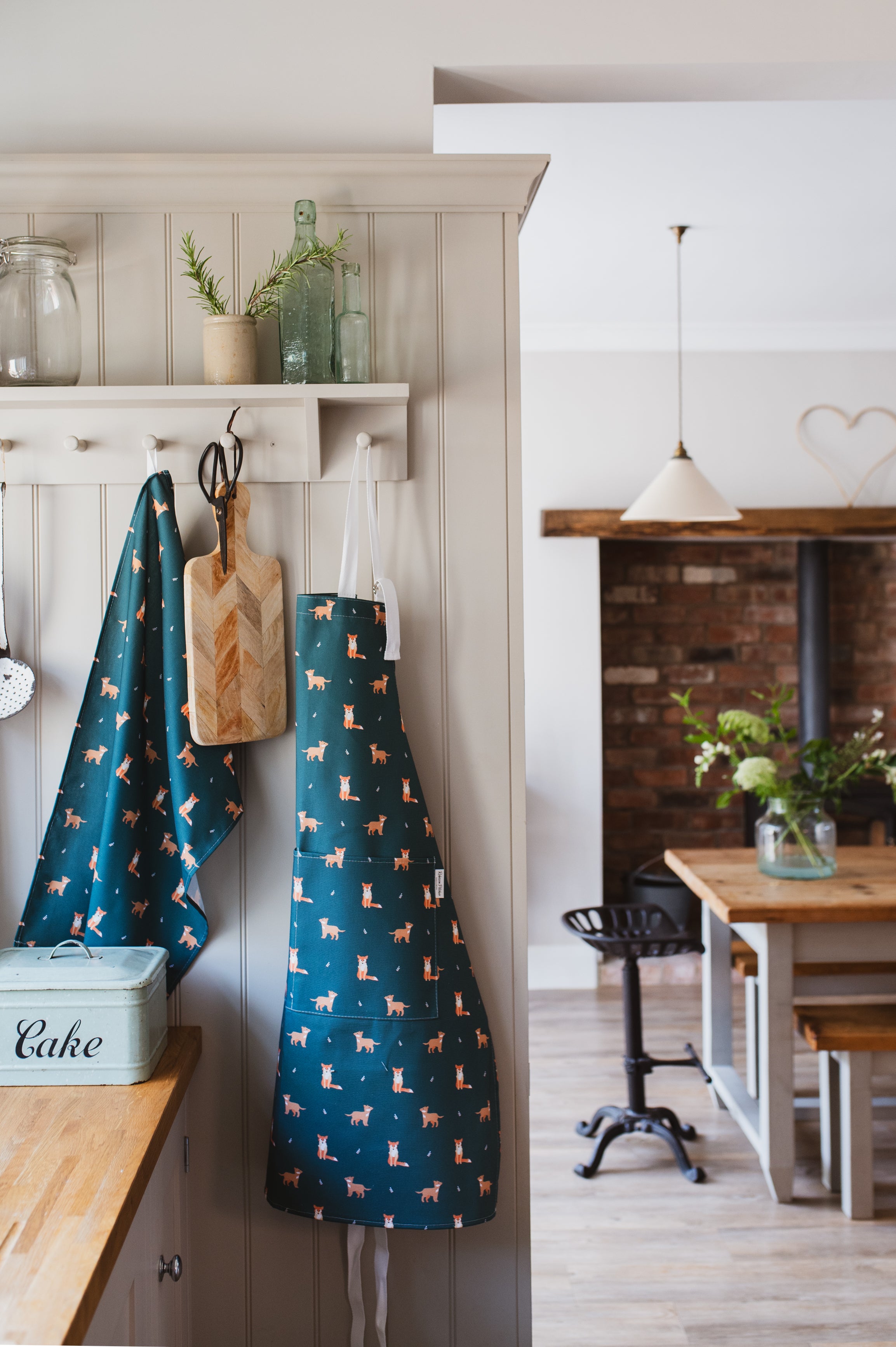 Green Fox apron and tea towel in a country kitchen