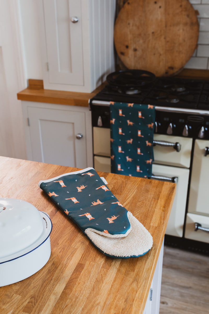 Dark Green Fox print long single oven glove in a country kitchen