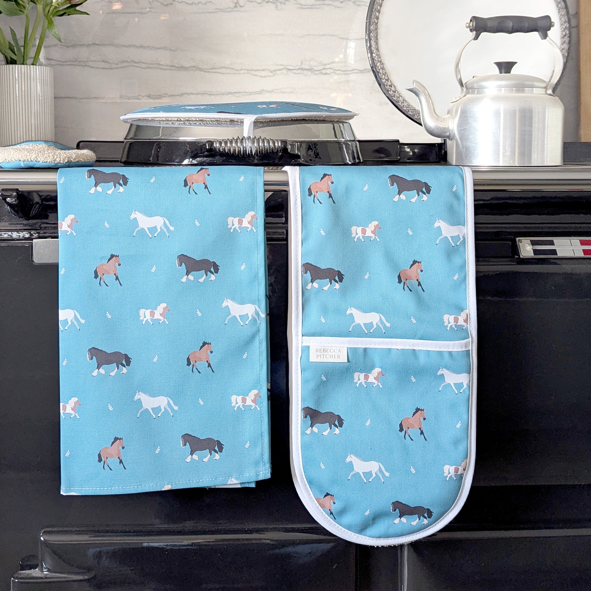Teal Horse and Pony design kitchen textiles; oven gloves, tea towel and hob cover