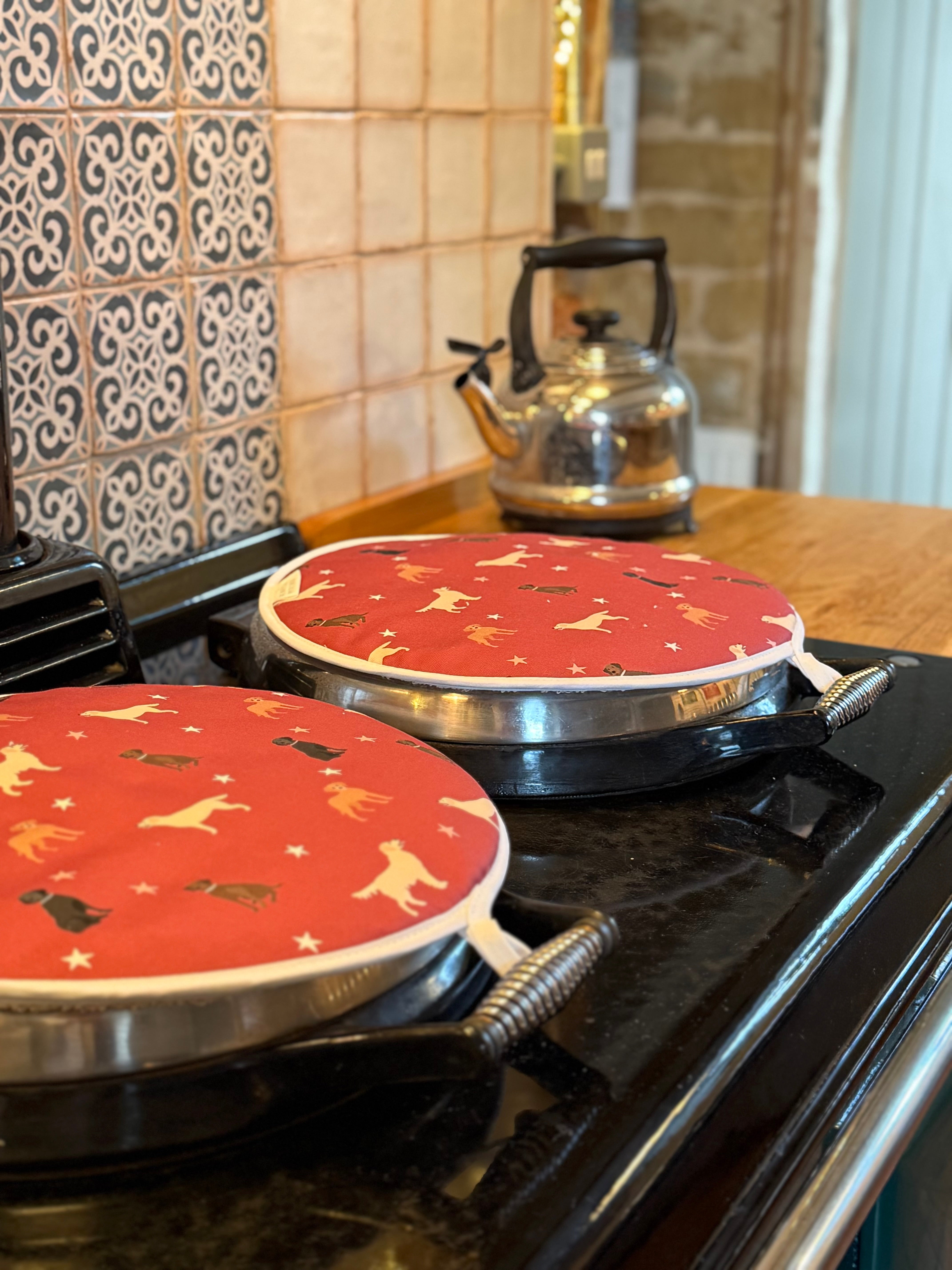 Red labrador dog pattern hob covers with kettle in a country kitchen