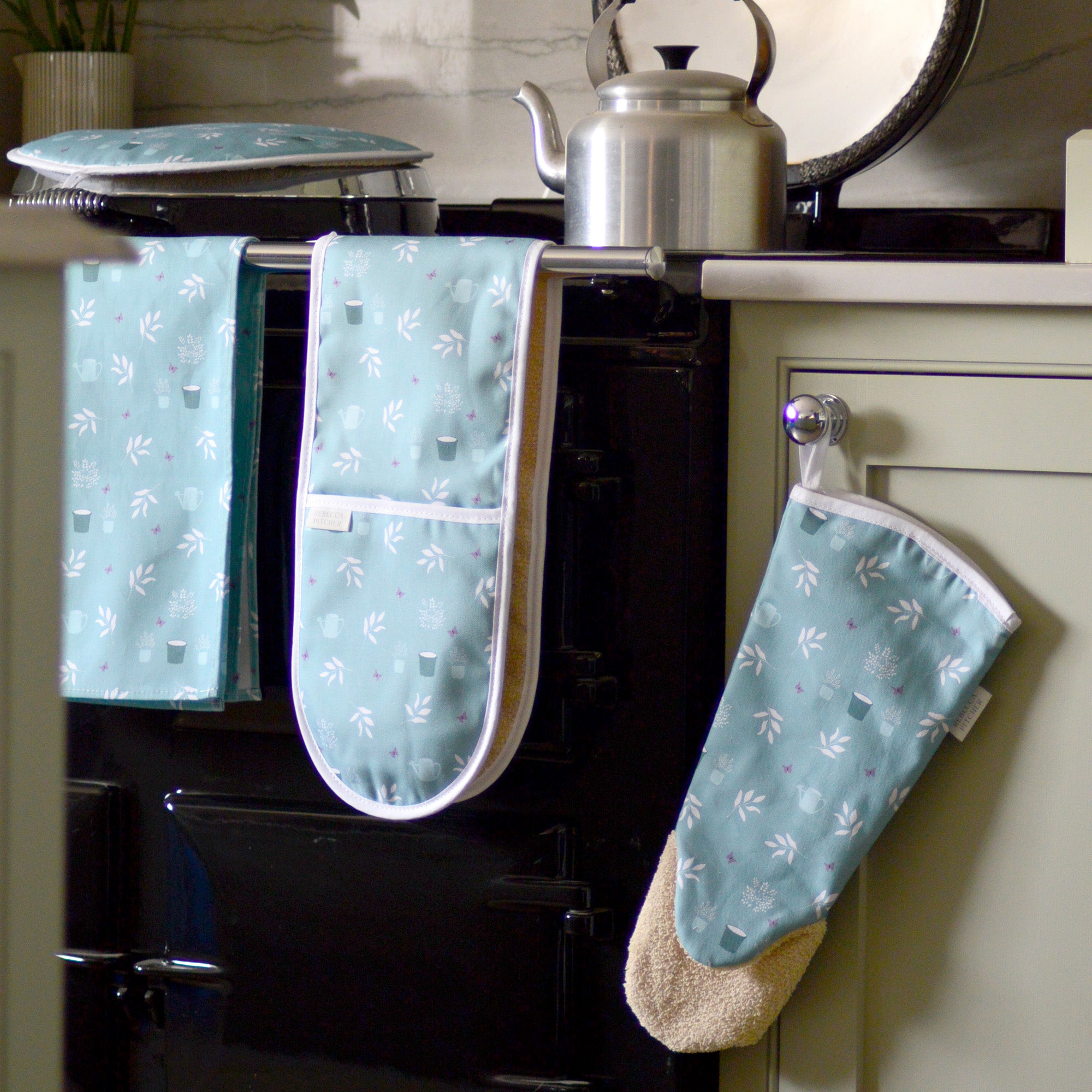 Duckegg olive garden design kitchen textiles on an Aga