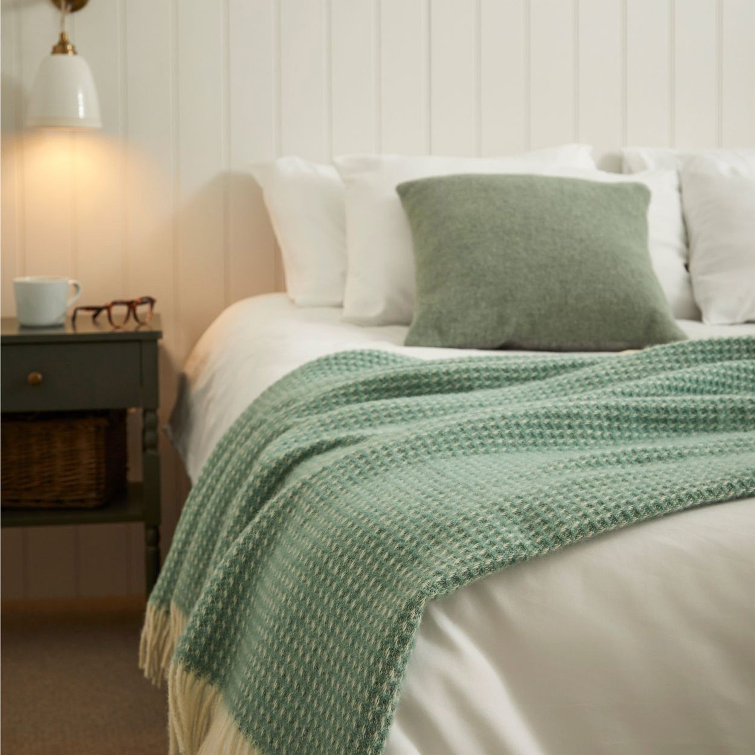 Sea Green Extra Long Wool Blanket on a Bed