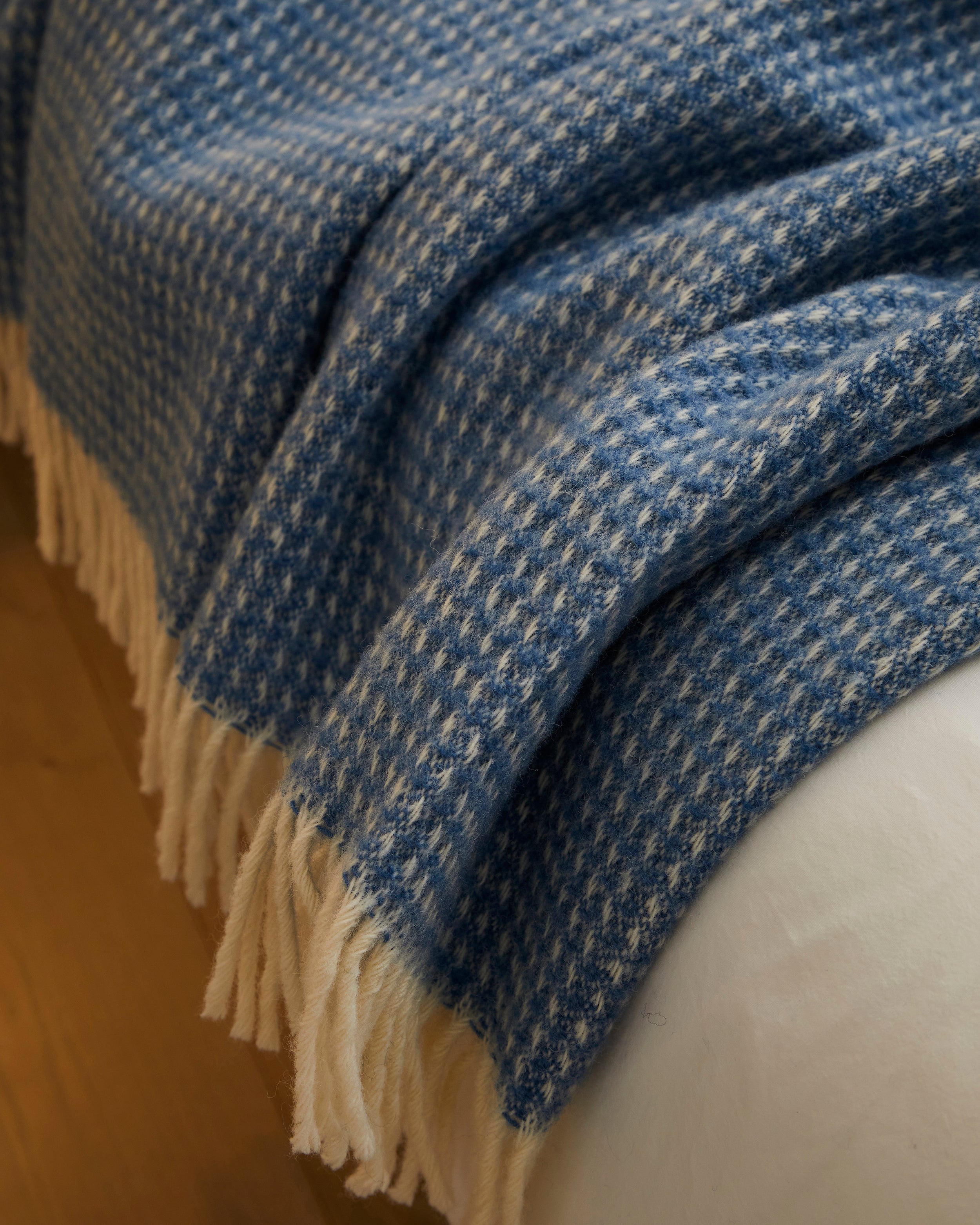 Close up detail of a blue wool blanket